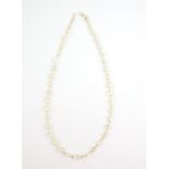 Moonstone necklace, thirty nine moonstones of varying shapes and size, s clasp, estimated length 47