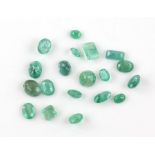 Nineteen loose faceted emeralds, including fifteen oval cuts weighing between 1.84-0.34 carats,