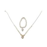 Links of London 'sweetie' necklace with silver rings and 10 gold plated rings and a heart charm,