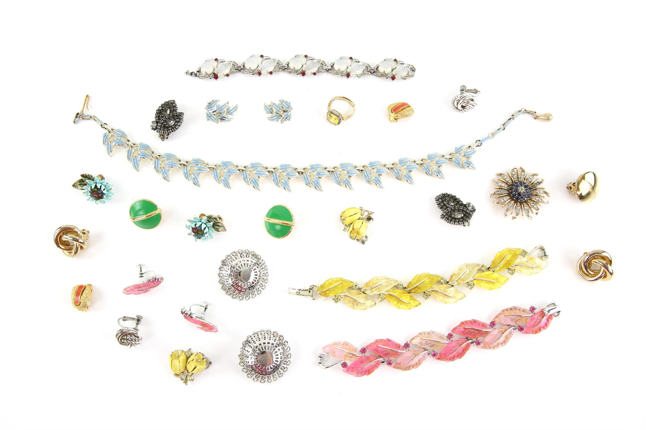 Designer costume jewellery, including a vintage Trifari floral brooch, paste set Trifari bracelets,