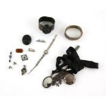 A group of silver items, including bangles, pencil in a silver case, powder compact and small