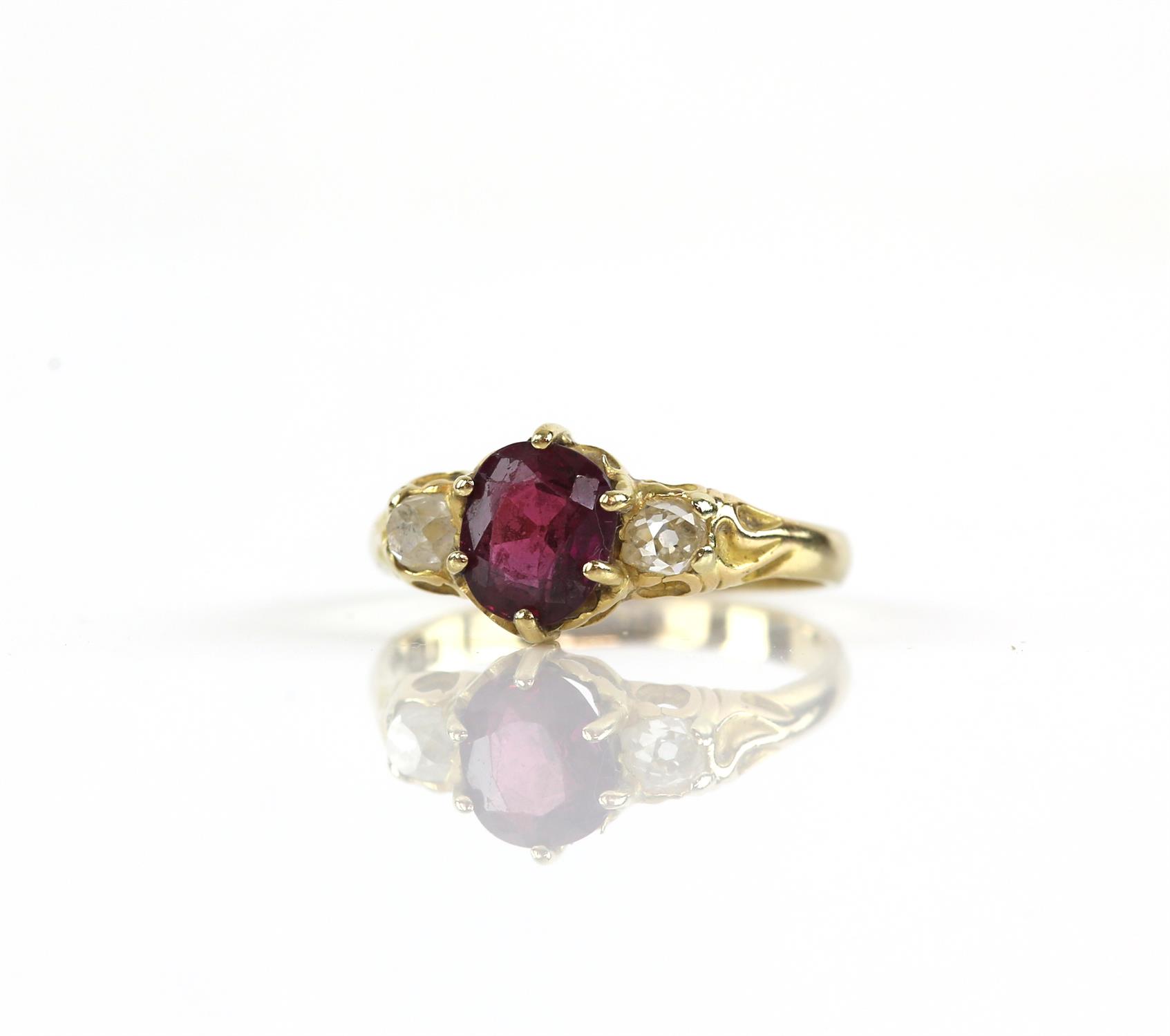 Three stone ruby and diamond ring, oval cut ruby weighing an estimated 1.45ct, with an old cut