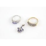 Three items of tanzanite set jewellery, including a tanzanite and diamond star pendant,