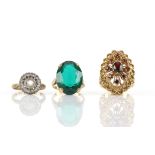 Three rings, including a garnet cluster ring, size Q, a green paste single stone ring,