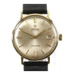 Omega A Gentleman's Seamaster gold top wristwatch, the signed dial with baton hour markers,