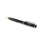 Mont Blanc, black resin ball point pen with gold band and clip, marked Mont Blanc in white to