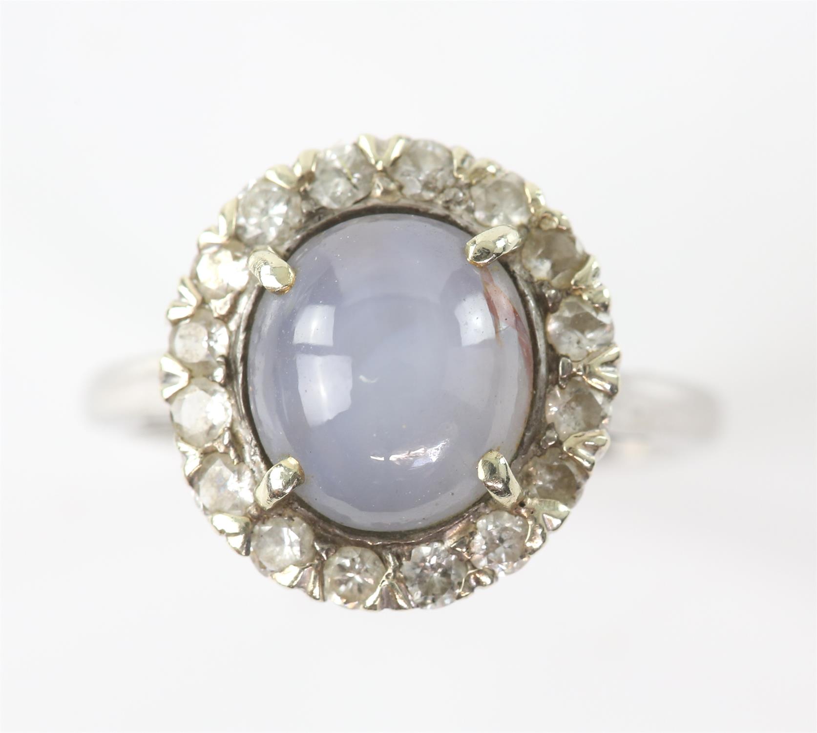 Star sapphire and diamond cluster ring, central oval cabochon cut sapphire, estimated weight 6. - Image 4 of 4