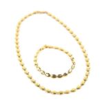 Necklace and bracelet set, designed as oval gold articulated links, on a lobster clasp,