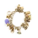Vintage charm bracelet, with approximately twenty-five charms, mainly 9 ct, including binoculars,