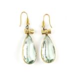 A pair of late 19th C aquamarine pendant earrings, consisting of two pear cut aquamarines,