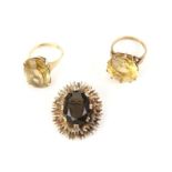 Two citrine cocktail rings, one set with a round cut citrine, weighing an estimated 18.50 carats,