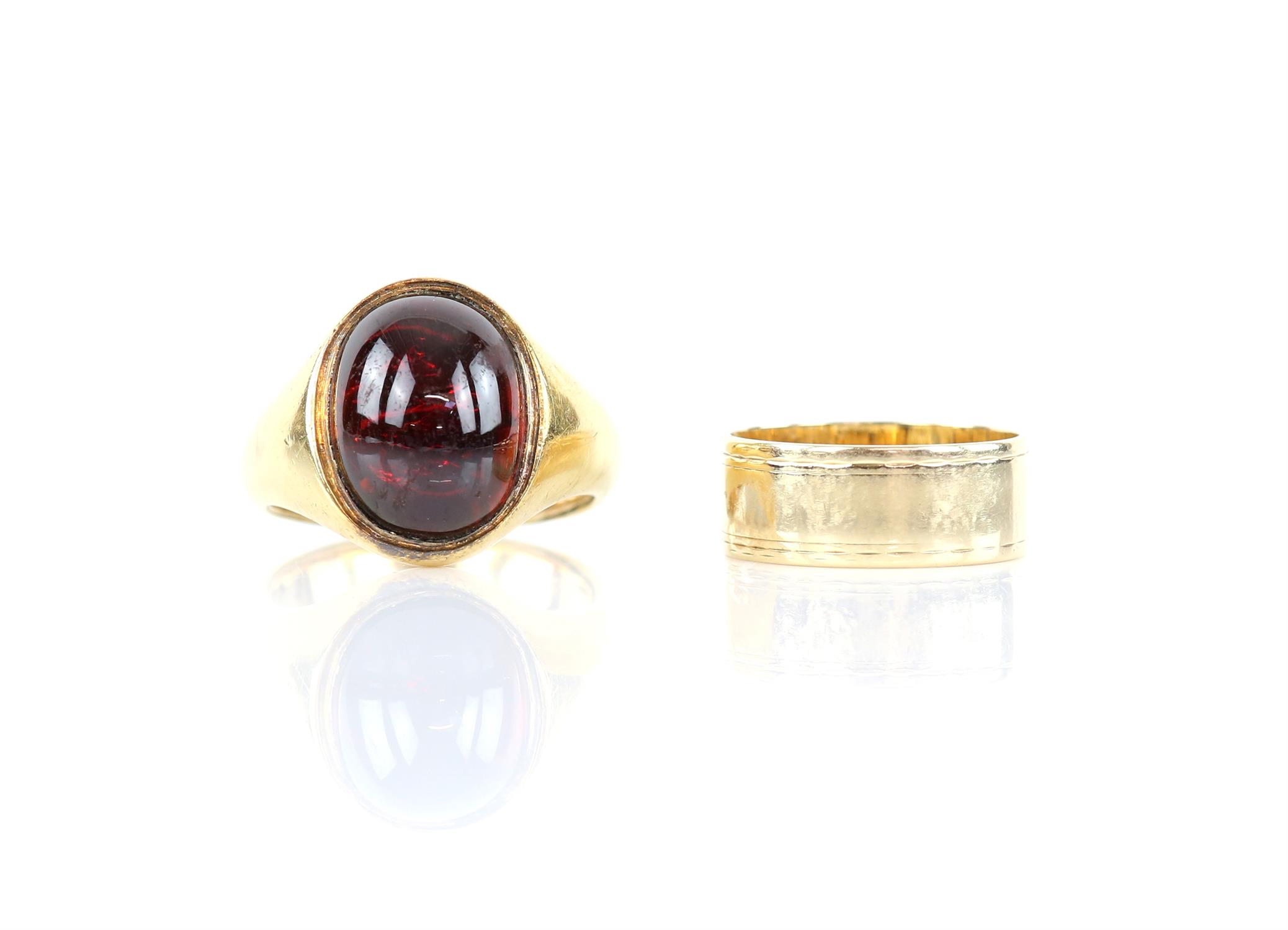 Cabochon cut red paste signet ring, mount testing as 18 ct with 9 ct internal band,