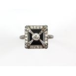 Onyx and diamond ring, old cut diamond to the centre of an onyx plaque, with single cut diamond