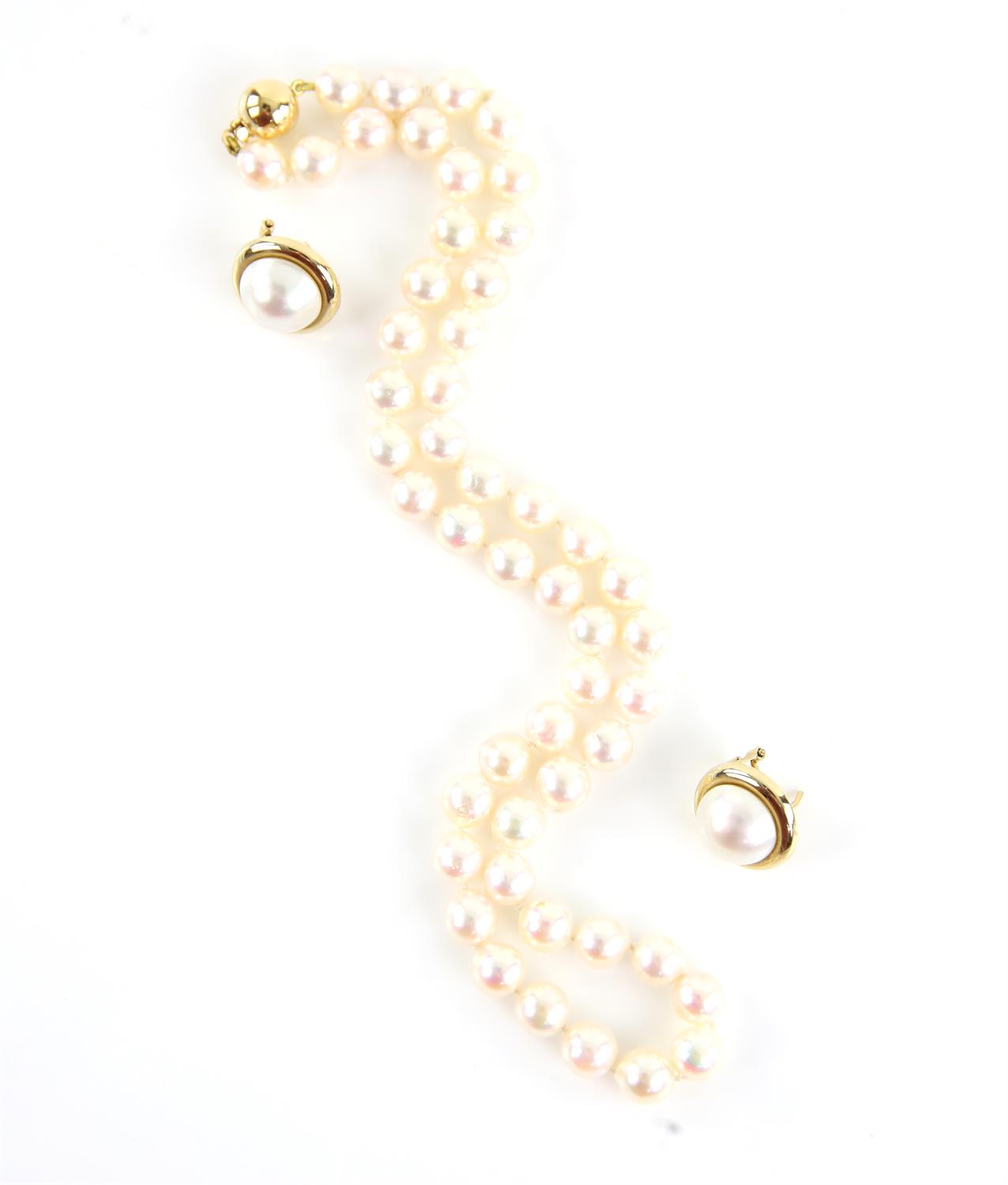 Pearl necklace, fifty 7.4-7.5mm cream pearls, strung knotted, on an 18 ct gold ball clasp,