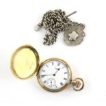 Waltham gold Hunter pocket watch, signed white enamel dial with Roman numeral hour markers,