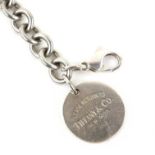 Tiffany & Co silver bracelet, with a round label marked Please Return to Tiffany New York,