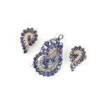 Sapphire and diamond swirl brooch pendant, set with round, oval, marquise and pear cut sapphires,