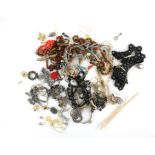 Bag of costume jewellery to include, a selection of carved bone items, coral bead necklace,