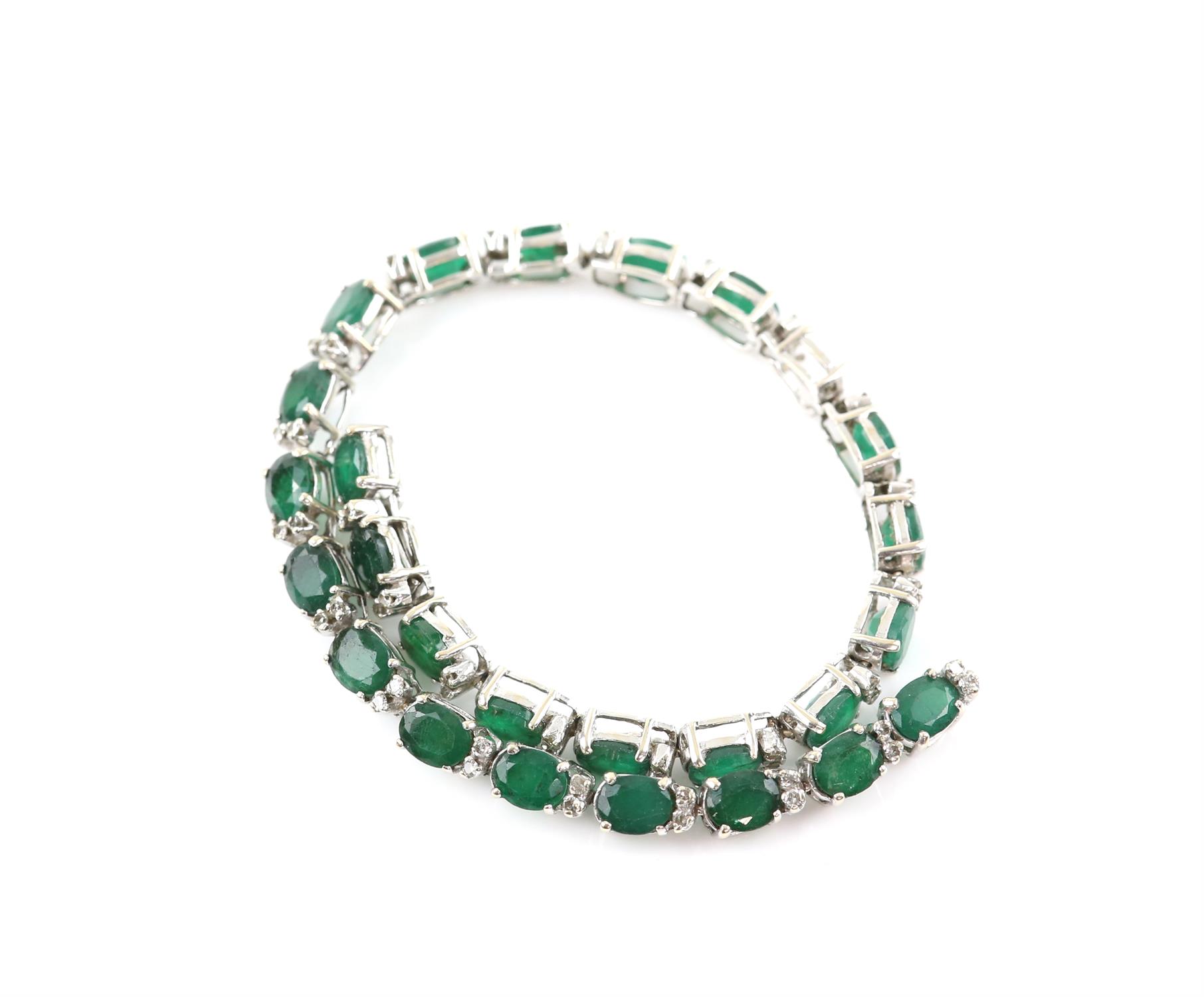 Emerald and diamond bracelet, twenty-six oval cut emeralds weighing an estimated total of 9.