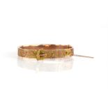 Victorian gold buckle bangle, floral engraved detail, in 9 ct yellow gold, hallmarked Birmingham