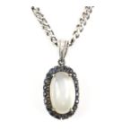 Moonstone and sapphire cluster pendant, central oval cabochon cut moonstone, 12 x 7.