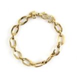 Oval flat link bracelet, with alternating matte and polished gold links, stamped 18 ct, length 19.