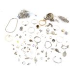 A group of silver chains, pendants, necklaces, earrings, bracelets and bangles, silver Ingot