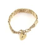 Vintage gold gate bracelet with fancy gold links with sections of brick link between,