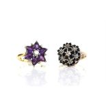 Two vintage floral cluster rings, including an amethyst and diamond cluster, with a central round