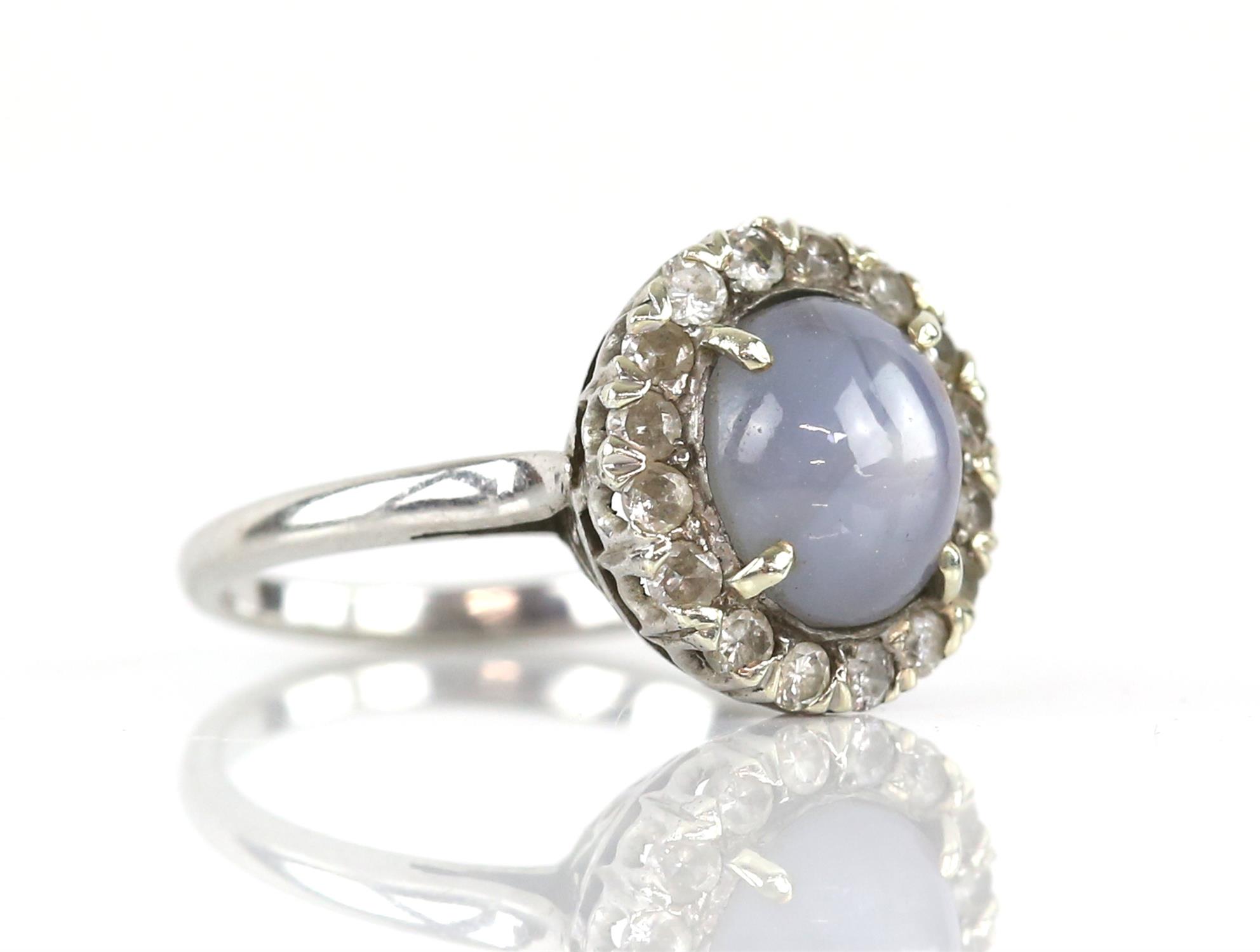 Star sapphire and diamond cluster ring, central oval cabochon cut sapphire, estimated weight 6. - Image 2 of 4