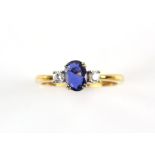 Sapphire and diamond ring, blue central oval sapphire estimated weight 0.59 carat,