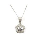 Diamond flower pendant, set with round brilliant cut diamonds, on a diamond set bail,