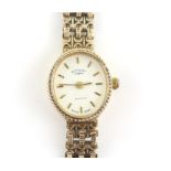 Rotary, a ladies gold case watch, oval dial with baton hour markers, quartz movement,