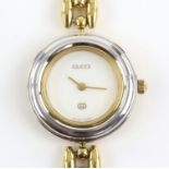 Gucci, a Ladies reference 11/12 wristwatch the signed white dial with gold hands,