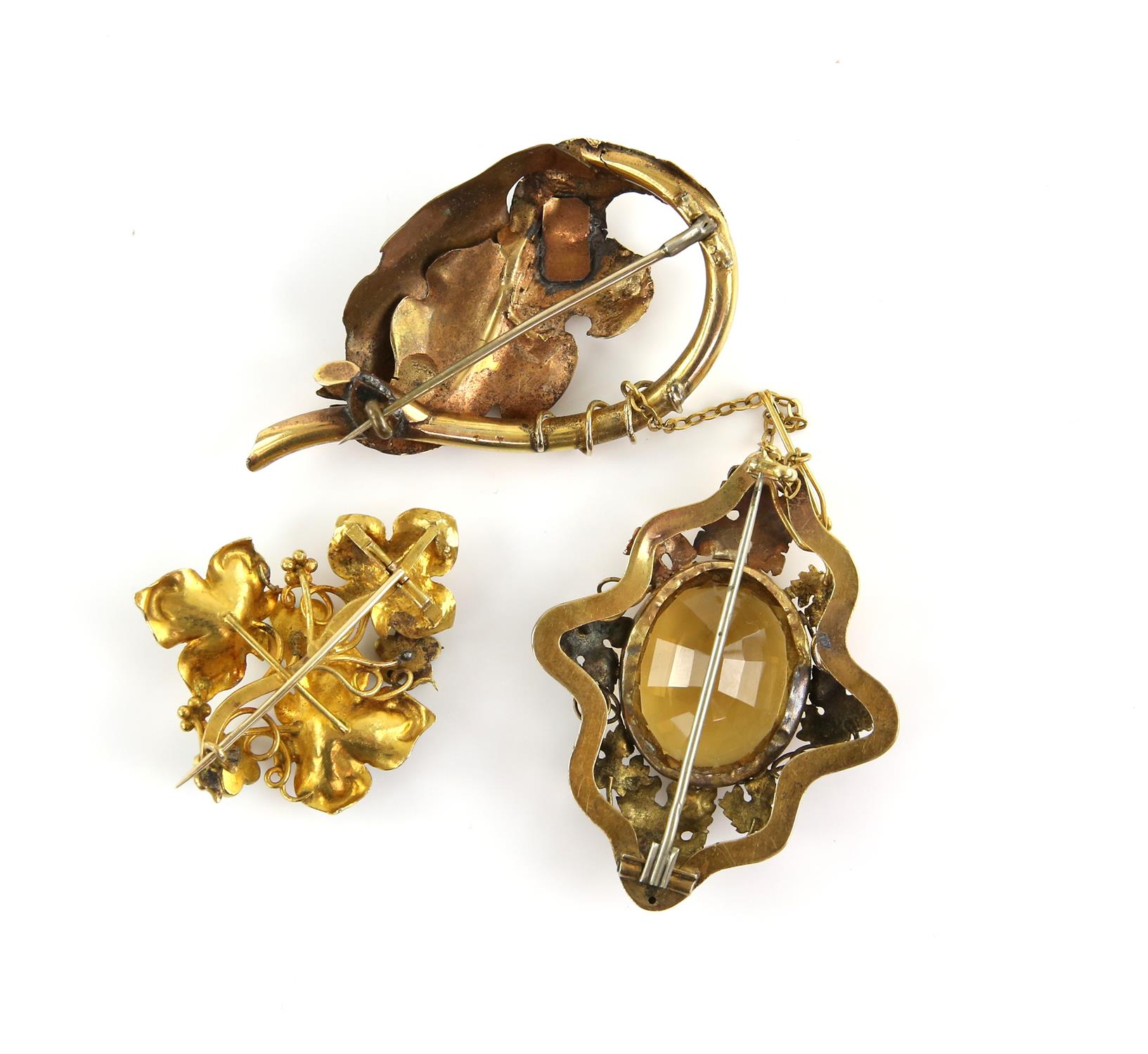 Three antique brooches, one Victorian vine leaf brooch centrally set with a large oval cabochon cut - Image 2 of 2