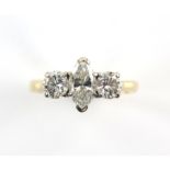 Three stone diamond ring, central marquise cut diamond weighing an estimated 0.88 carat,