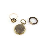 Victorian hairwork ring, with gold panel with scrolled initials engraved on both sides,