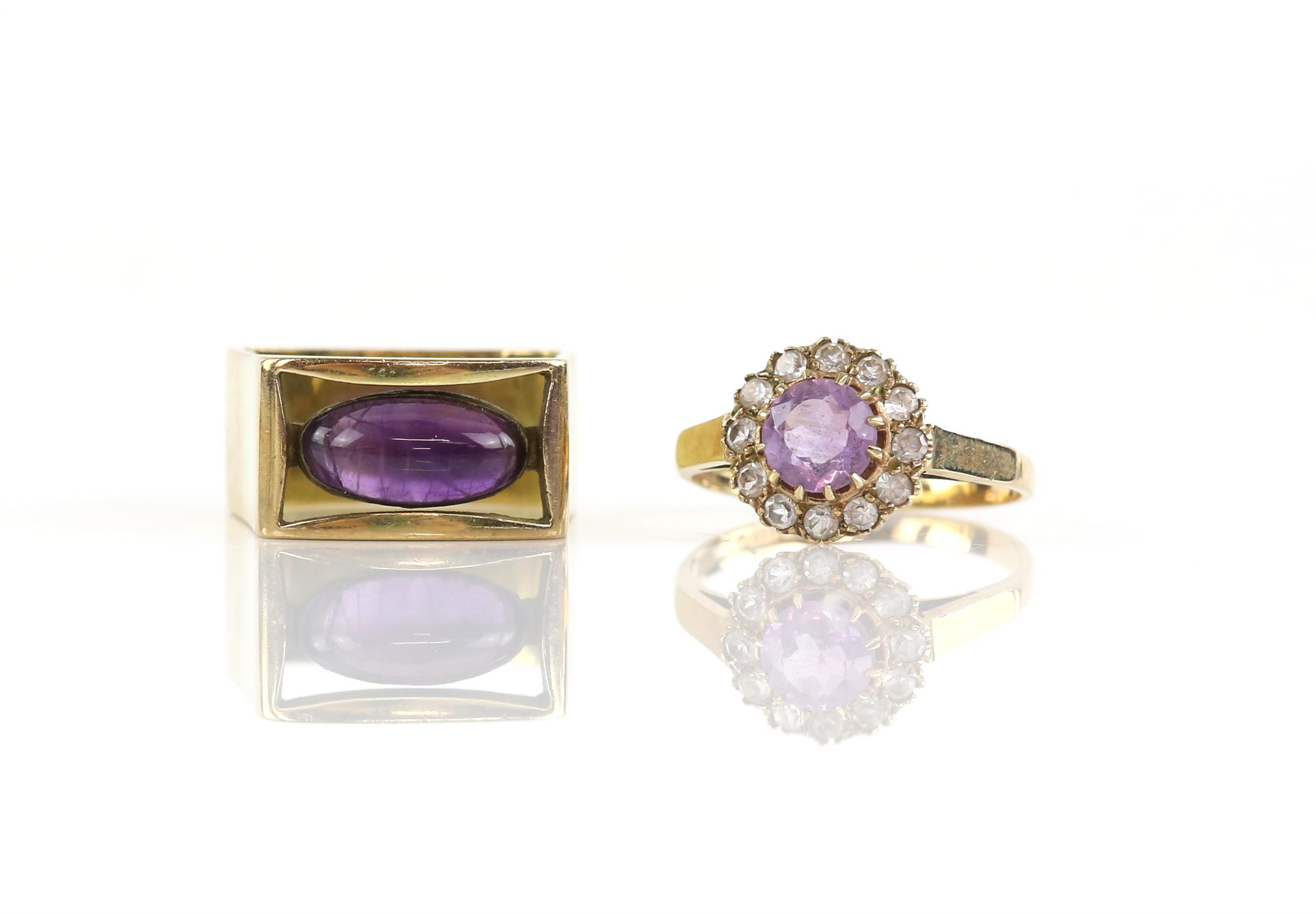 Two amethyst rings, including a modernist amethyst ring, one with an oval cabochon amethyst set in