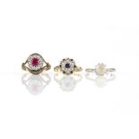 Three gem set rings, including a single stone white sapphire ring, stamped platinum, ring size P1/2,