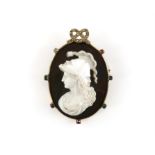 Sardonyx Cameo brooch, central panel depicting in a double faced helmet with a serpent,