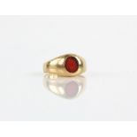 Vintage signet ring, set with a red glass seal, in 18 ct, ring size J1/2