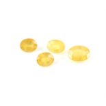 Four faceted oval cut loose synthetic yellow sapphires, weighing an estimated 3.63 carats, 2.