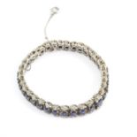 Sapphire and diamond bracelet, with graduating round cut sapphires, in articulated links,