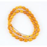 Amber bead necklace, graduated oval beads, largest bead measuring 17 x 13mm, smallest bead