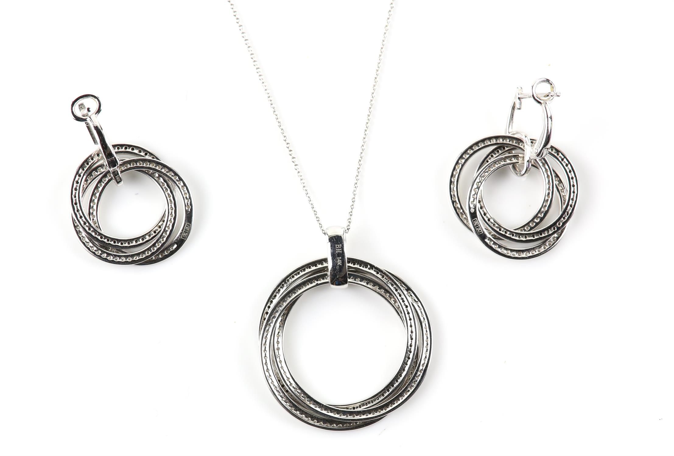 Contemporary black and white diamond pendant with matching earrings, designed as three interlocking - Image 2 of 2
