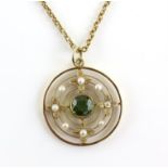 Edwardian pendant, centrally set with a round cut peridot, estimated weight 1.39 carats,