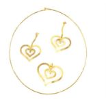 Pendant and earring suite, the gold pendant is designed as a double open heart with a hammered