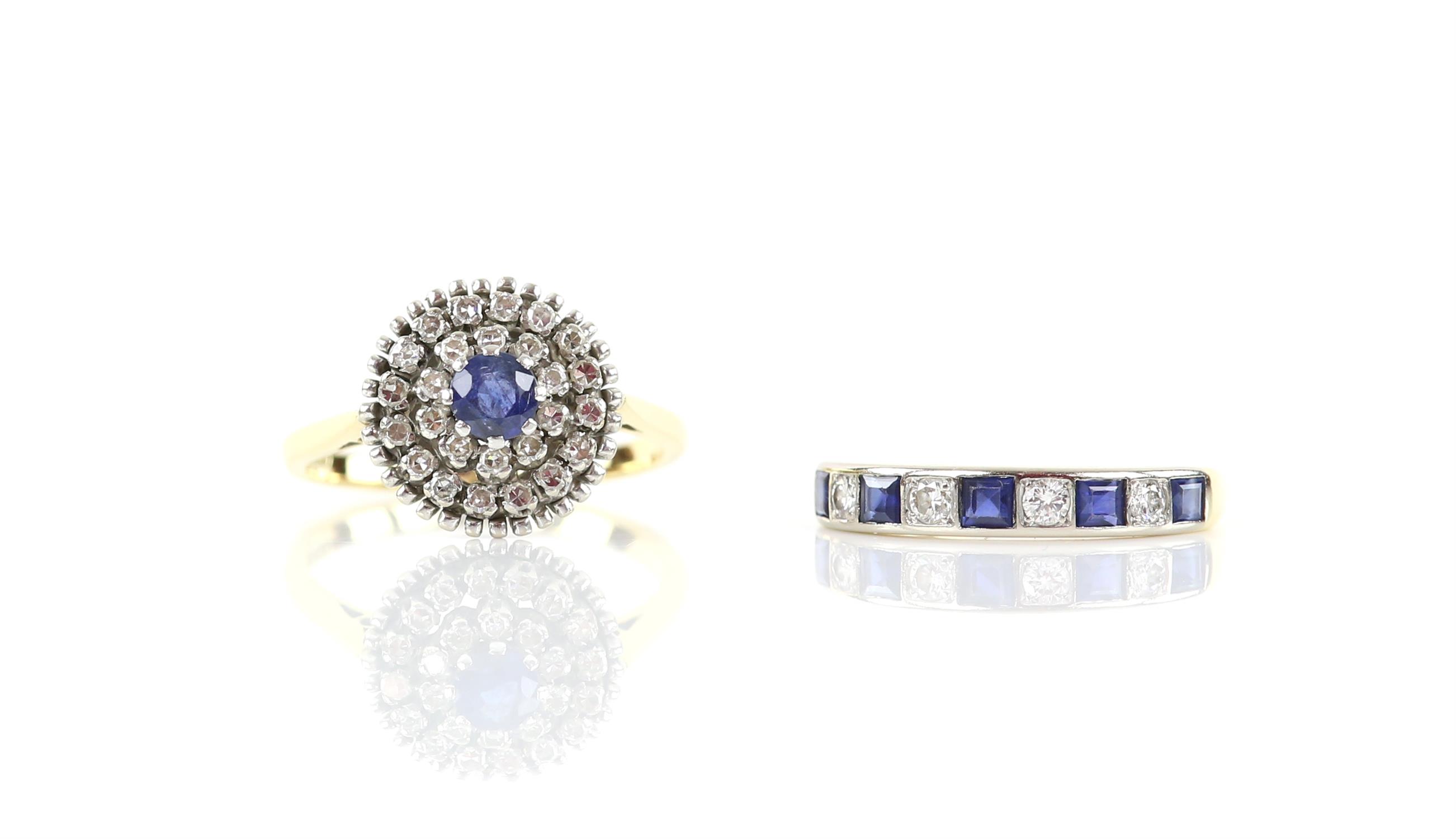 Sapphire and diamond cluster ring, centrally set with a round cut sapphire surrounded two rows of