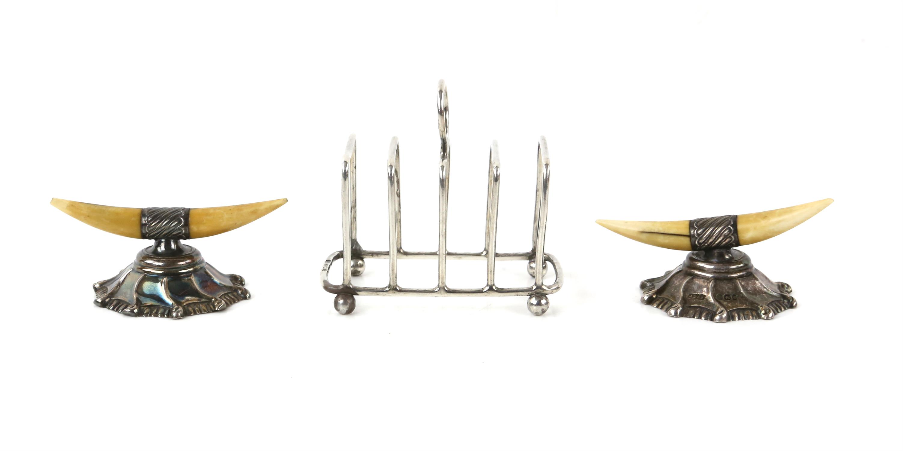 Pair of Victorian silver and tusk knife/cutlery rests by JDS Sheffield, 1899 and a silver toast