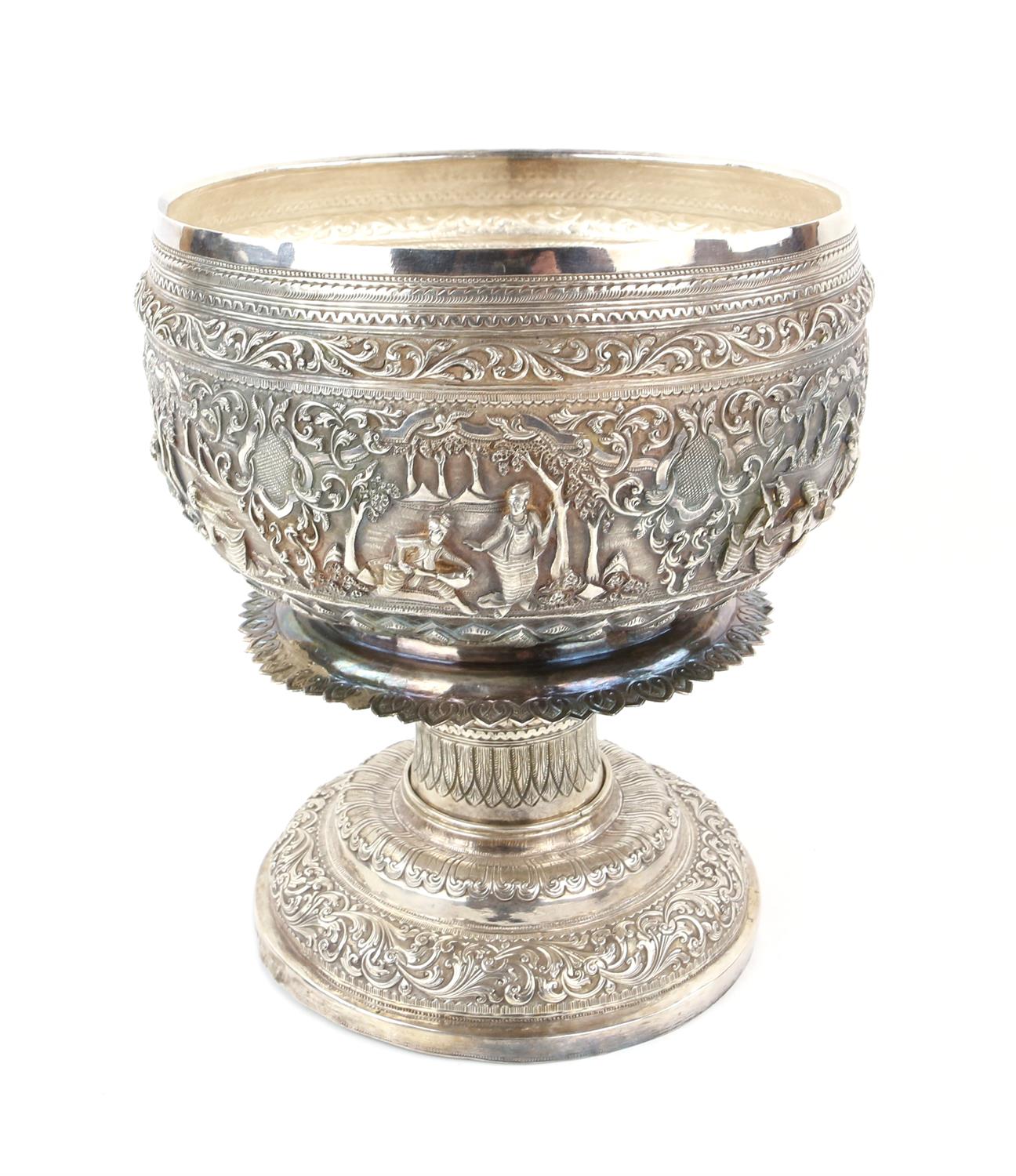 Burmese white metal pedestal bowl and cover with embossed figural and scrolling foliate decoration, - Image 4 of 6